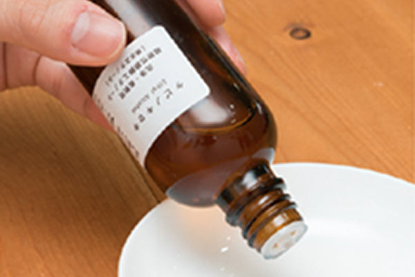 Pour a small amount of ethanol into a small dish.