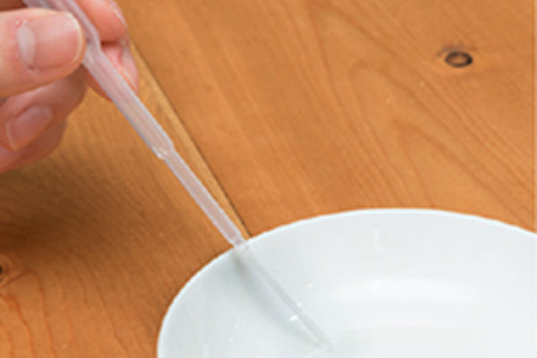 Draw up the ethanol with a dropper.